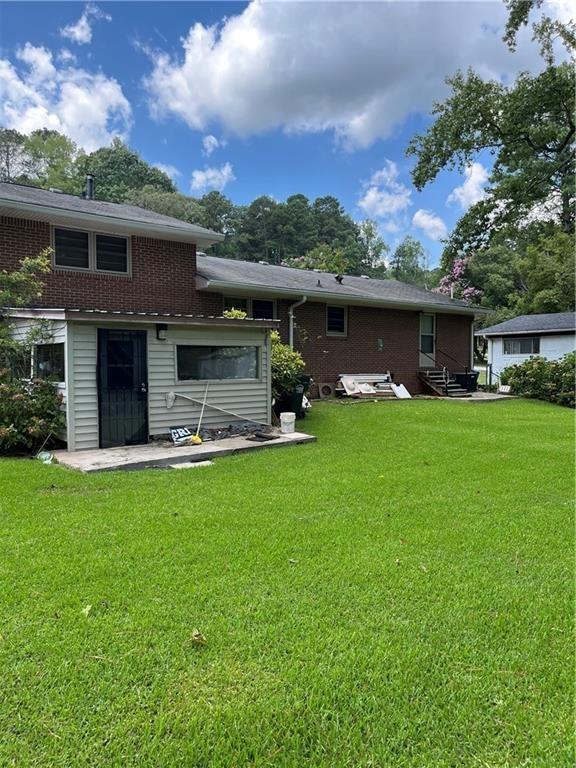 4050 Welcome All Terrace Atlanta, GA 30349 - Photo 8 of 10 a front view of house with yard