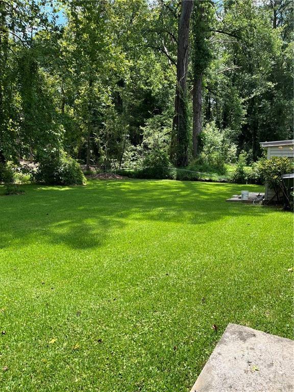 4050 Welcome All Terrace Atlanta, GA 30349 - Photo 9 of 10 a view of a grassy field with trees