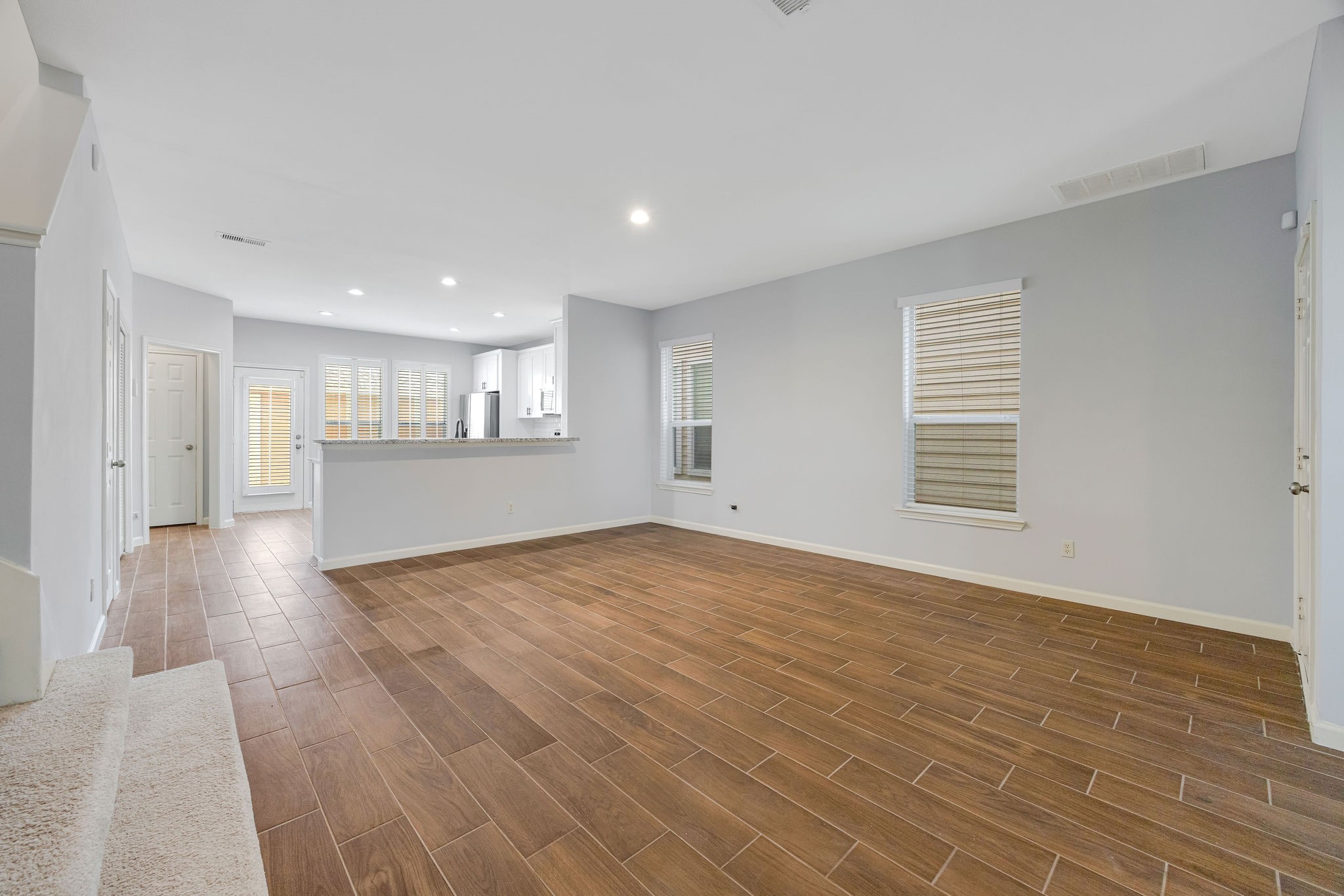 8018 Grow Lane Houston, TX 77040 - Photo 3 of 20 Wood like tile throughout, recessed lighting, and plenty space to make it your own.