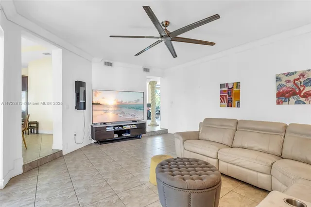 a large kitchen with a table and chairs