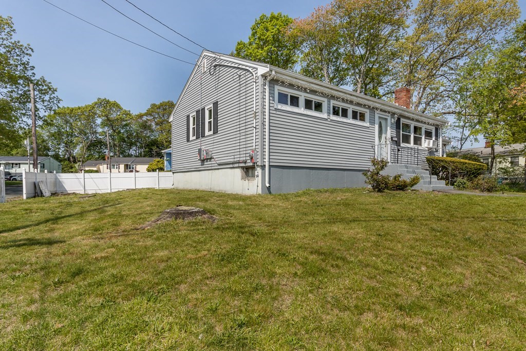 1 Desmond Road Randolph, MA 02368 - Photo 2 of 18 a view of a house with a yard