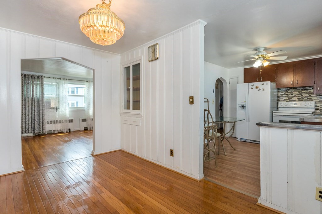 1 Desmond Road Randolph, MA 02368 - Photo 8 of 18 a view of a hallway to a livingroom with furniture