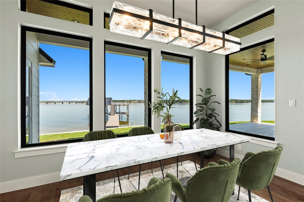 4054 Smothers Road Caney City, TX 75148 - Photo 8 of 40 Virtually Staged- Lakeside dining with expansive windows overlooking the water.