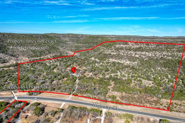 an aerial view of residential house and green space
