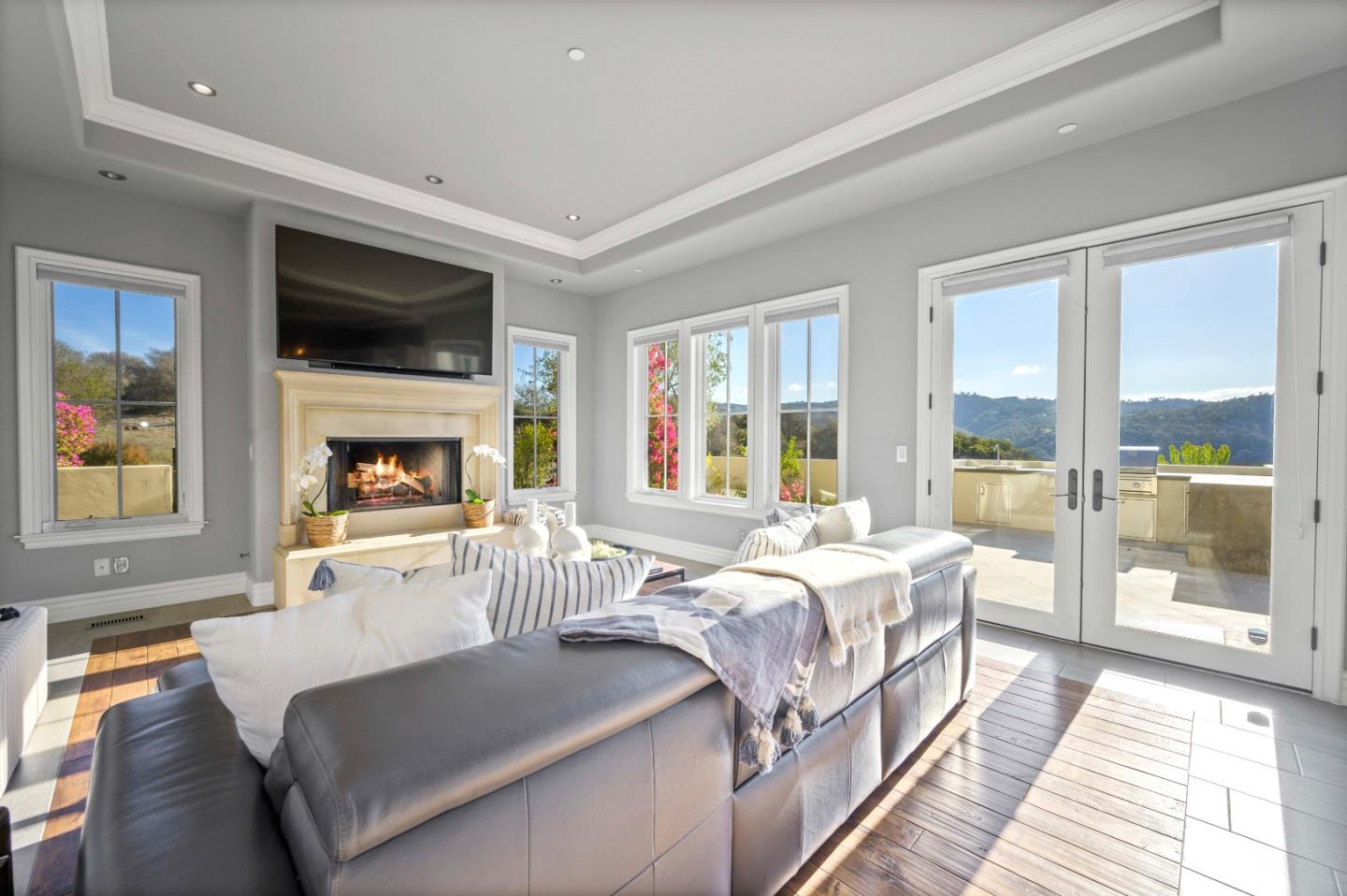 700 Tesoro Road Monterey, CA 93940 - Photo 22 of 47 a bedroom with a large bed a flat tv screen and a fireplace