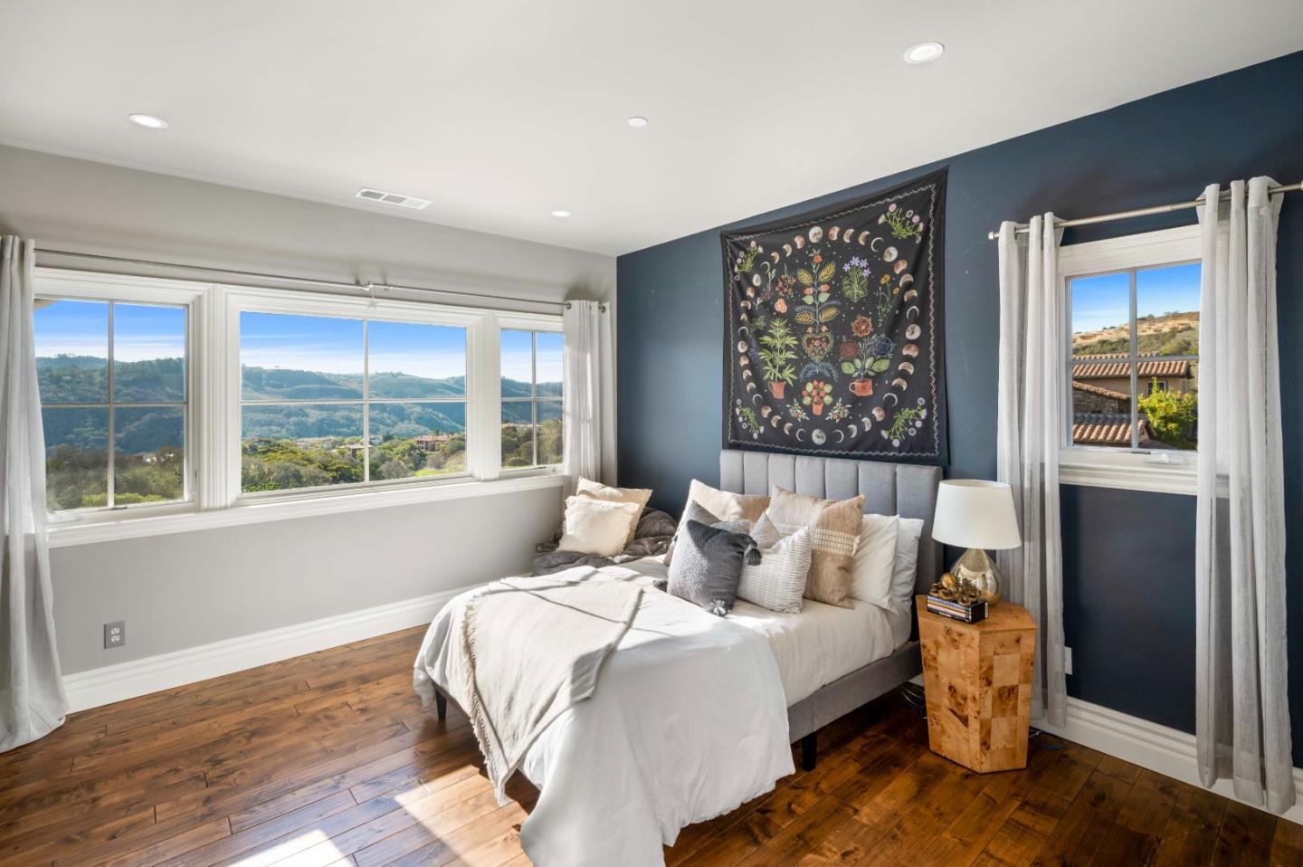 700 Tesoro Road Monterey, CA 93940 - Photo 31 of 47 a bedroom with a large bed and a large window