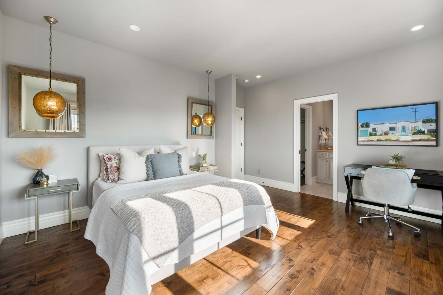 700 Tesoro Road Monterey, CA 93940 - Photo 32 of 47 a bedroom with a bed and a chandelier