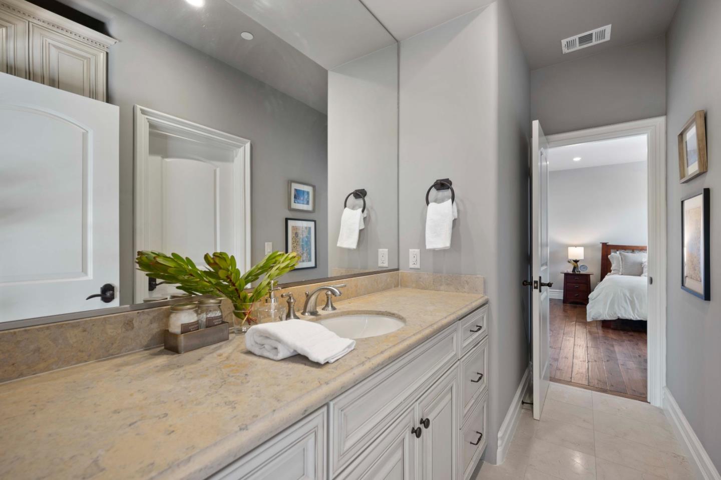 700 Tesoro Road Monterey, CA 93940 - Photo 36 of 47 a spacious en suite bathroom with a granite countertop sink and a mirror