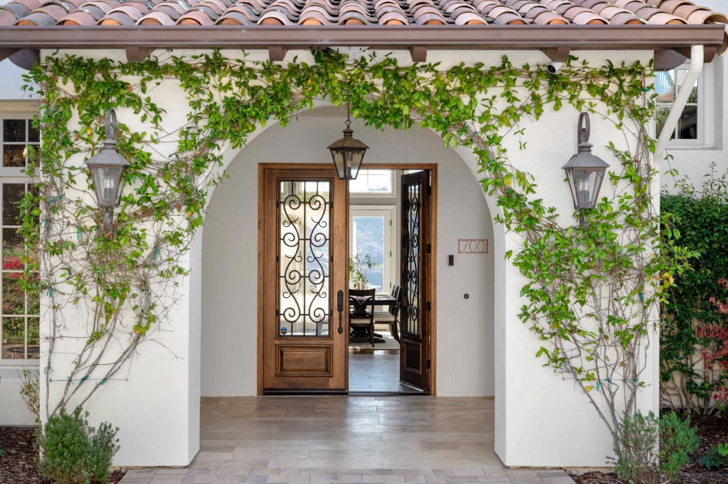 700 Tesoro Road Monterey, CA 93940 - Photo 4 of 47 a front view of a house with a yard fountain and sitting area