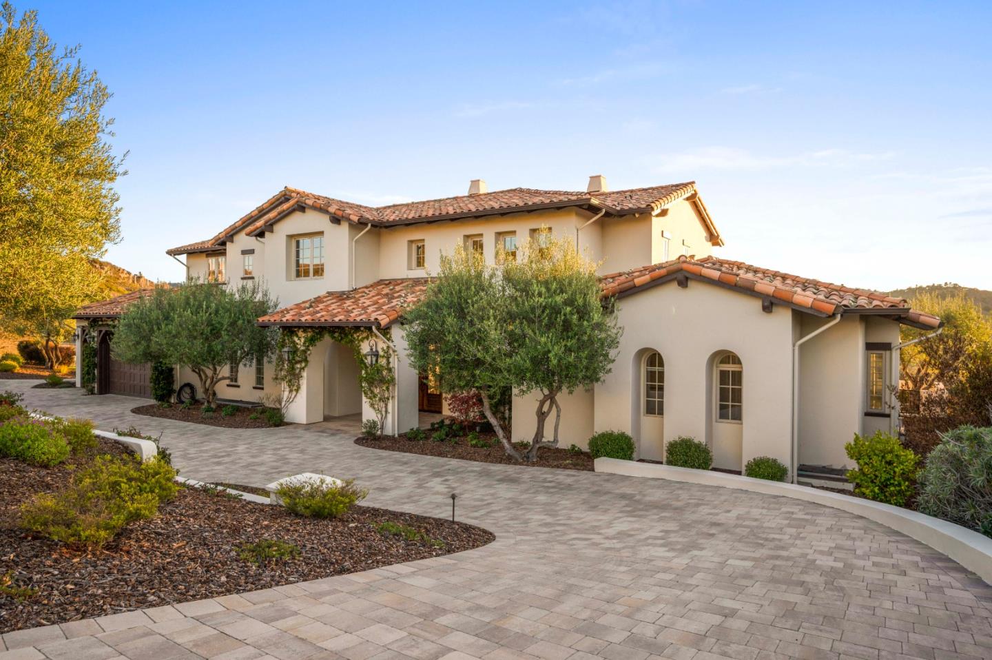 700 Tesoro Road Monterey, CA 93940 - Photo 45 of 47 a view of a white house with a small yard and a large tree