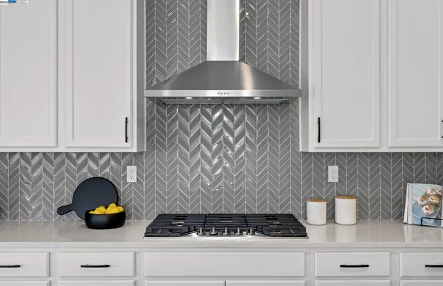 a kitchen with a cabinets and a potted plant