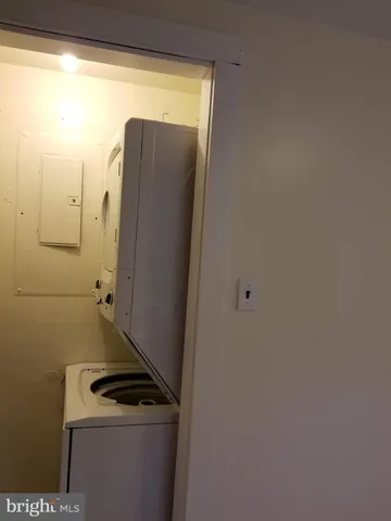 a view of a storage and utility room with a washer dryer