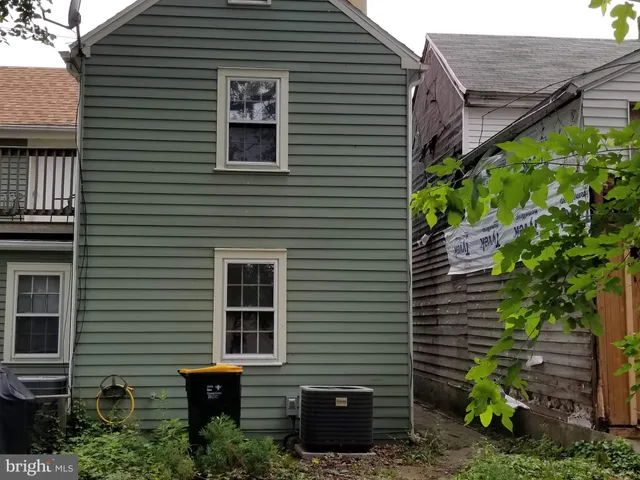 a view of a house with a yard and plants