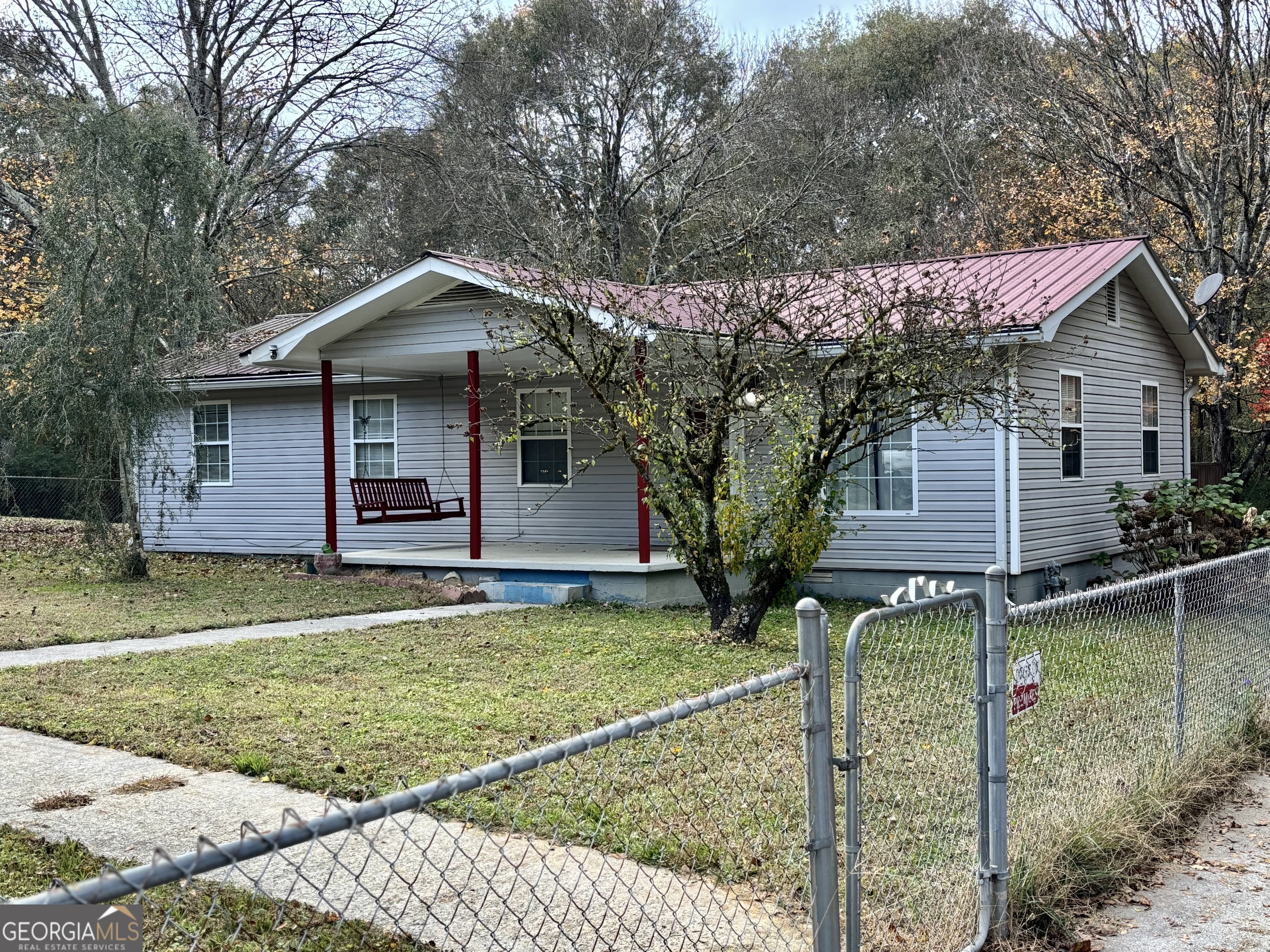 134 Raymond Street Summerville, GA 30747 - Photo 3 of 22 a front view of a house with garden