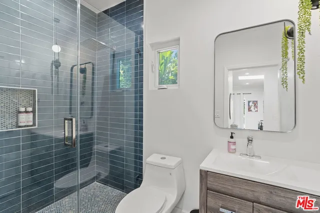 a view of a patio with table and chairs and potted plants