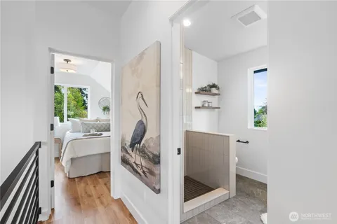 a bathroom with a double vanity sink and a large mirror