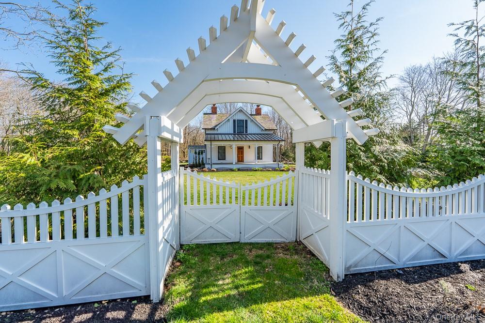 19000 Main Road Mattituck, NY 11952 - Photo 32 of 32 Gate with covered porch