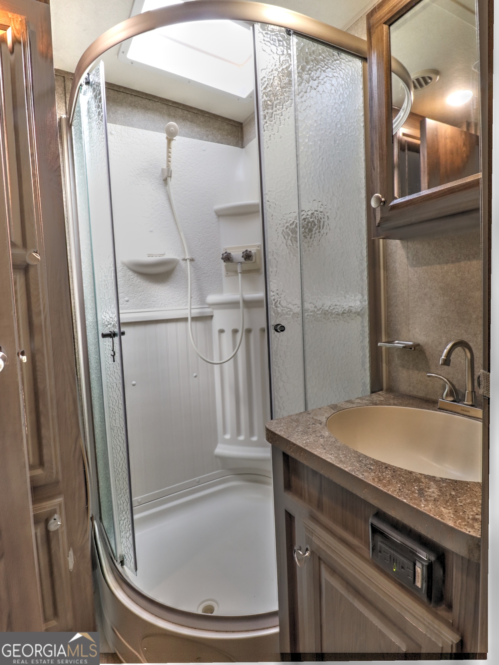 148 Tip Top Circle Cleveland, GA 30528 - Photo 15 of 32 a bathroom with a granite countertop bathtub shower sink and mirror