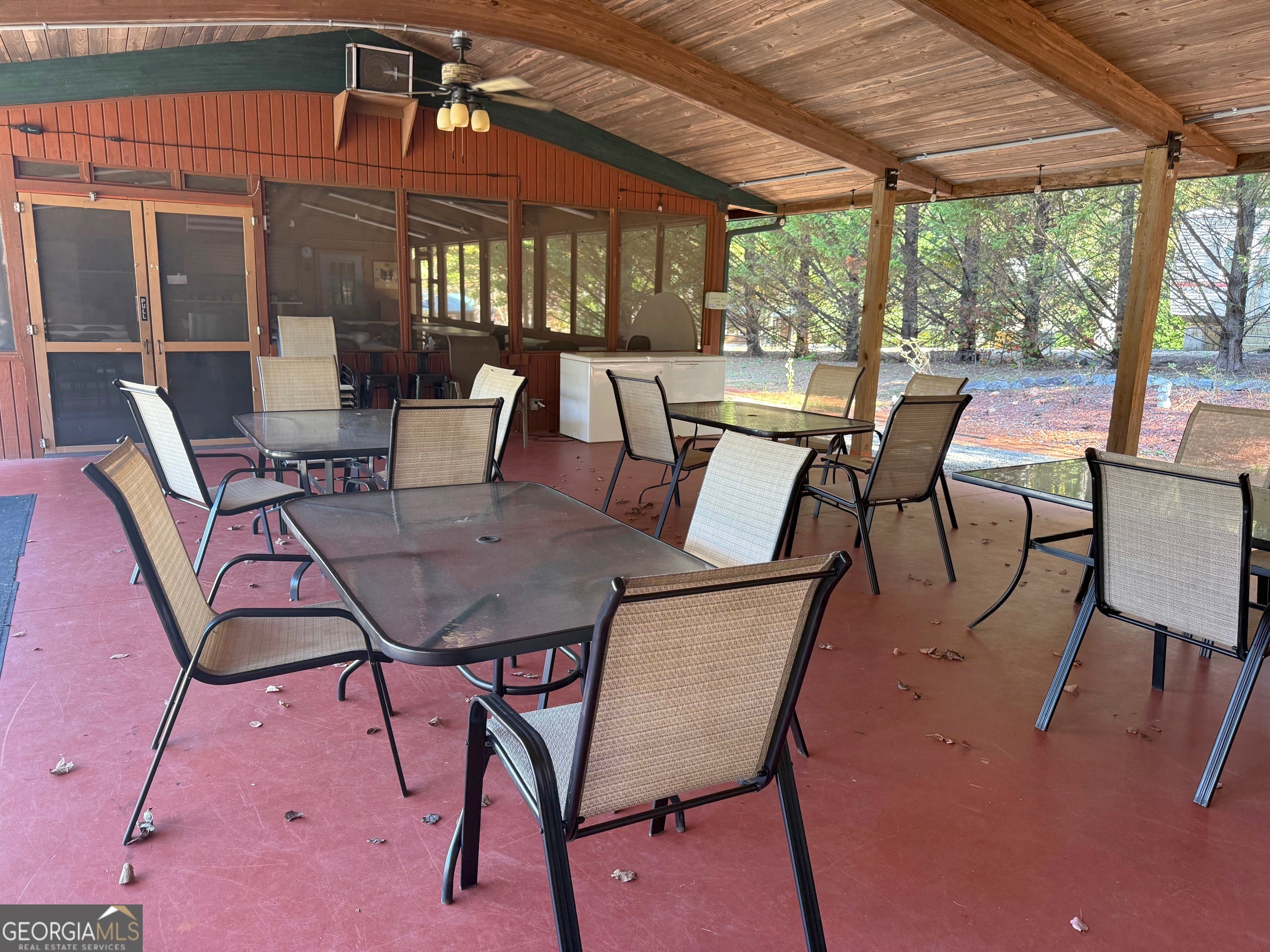 148 Tip Top Circle Cleveland, GA 30528 - Photo 29 of 32 a view of a patio with a table and chairs