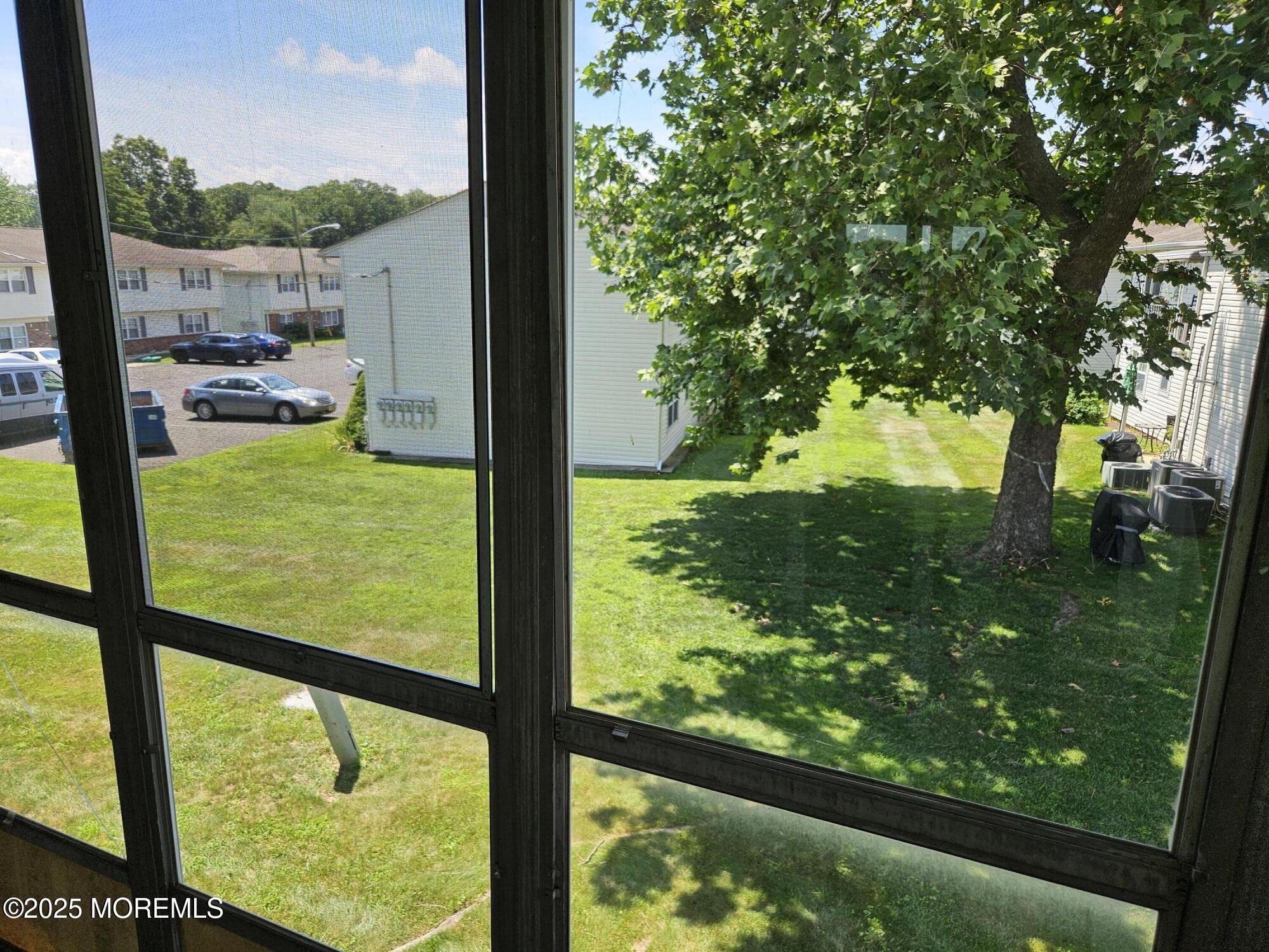 72 Haven Drive, Unit 500 Matawan, NJ 07747 - Photo 14 of 19 a view of lake from a window