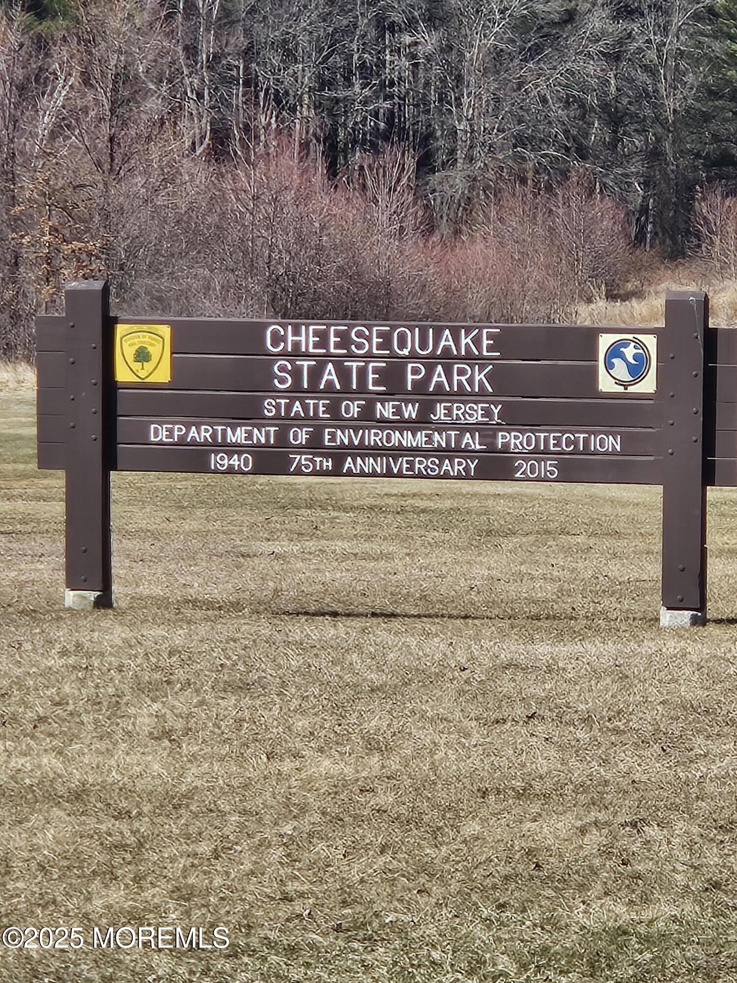 72 Haven Drive, Unit 500 Matawan, NJ 07747 - Photo 18 of 19 a view of outdoor space with signage and stairs