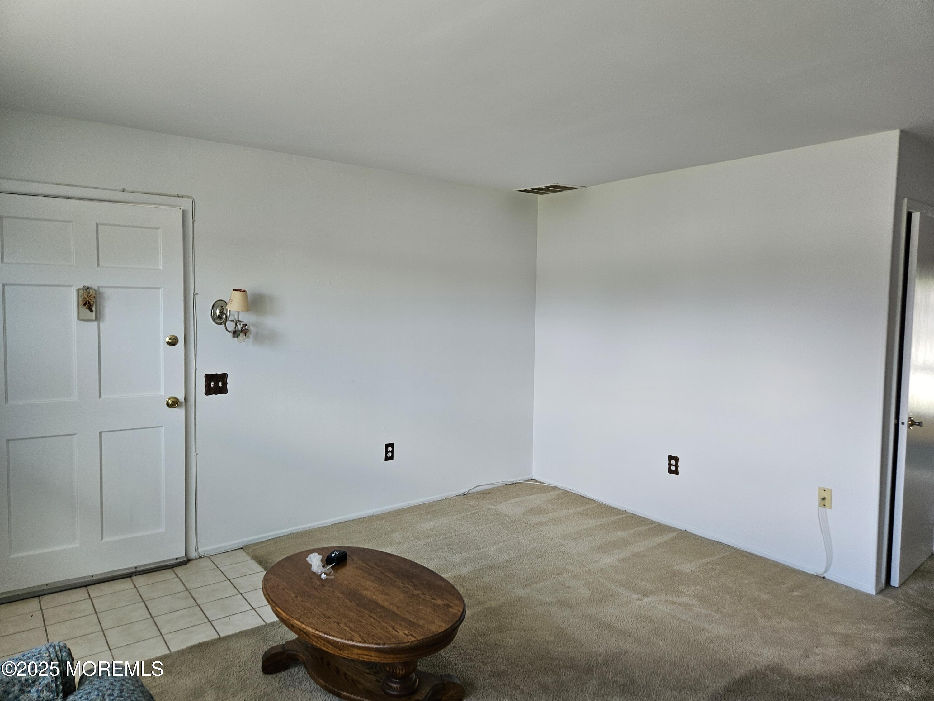 72 Haven Drive, Unit 500 Matawan, NJ 07747 - Photo 3 of 19 a view of a room with a carpet