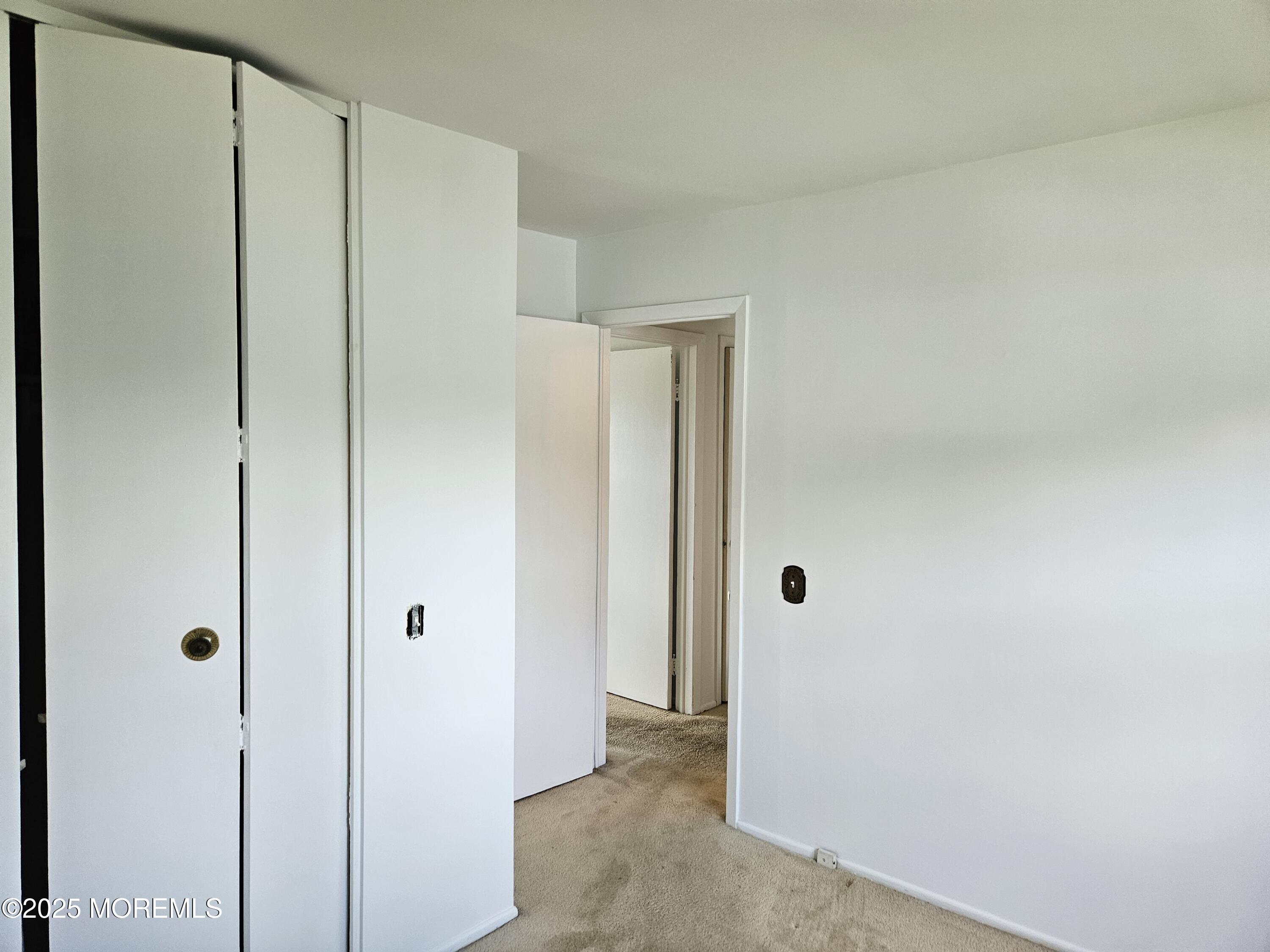 72 Haven Drive, Unit 500 Matawan, NJ 07747 - Photo 10 of 19 a view of a closet in a house