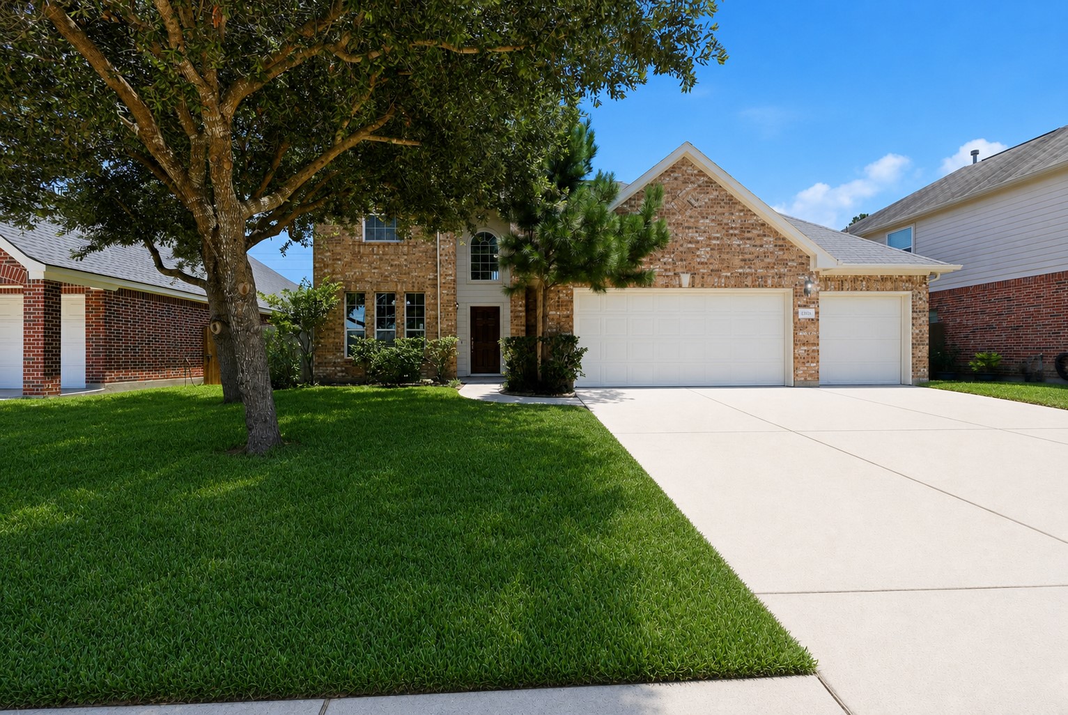 25926 Morgan Springs Spring, TX 77373 - Photo 2 of 49 Another view of the front elevation highlights the lush green lawn, mature trees, and attractive landscaping that enhance this home's curb appeal. Situated on a desirable greenbelt lot within a gated community, this home offers both beauty and privacy. Low property taxes! All gated community with natural walks and more!