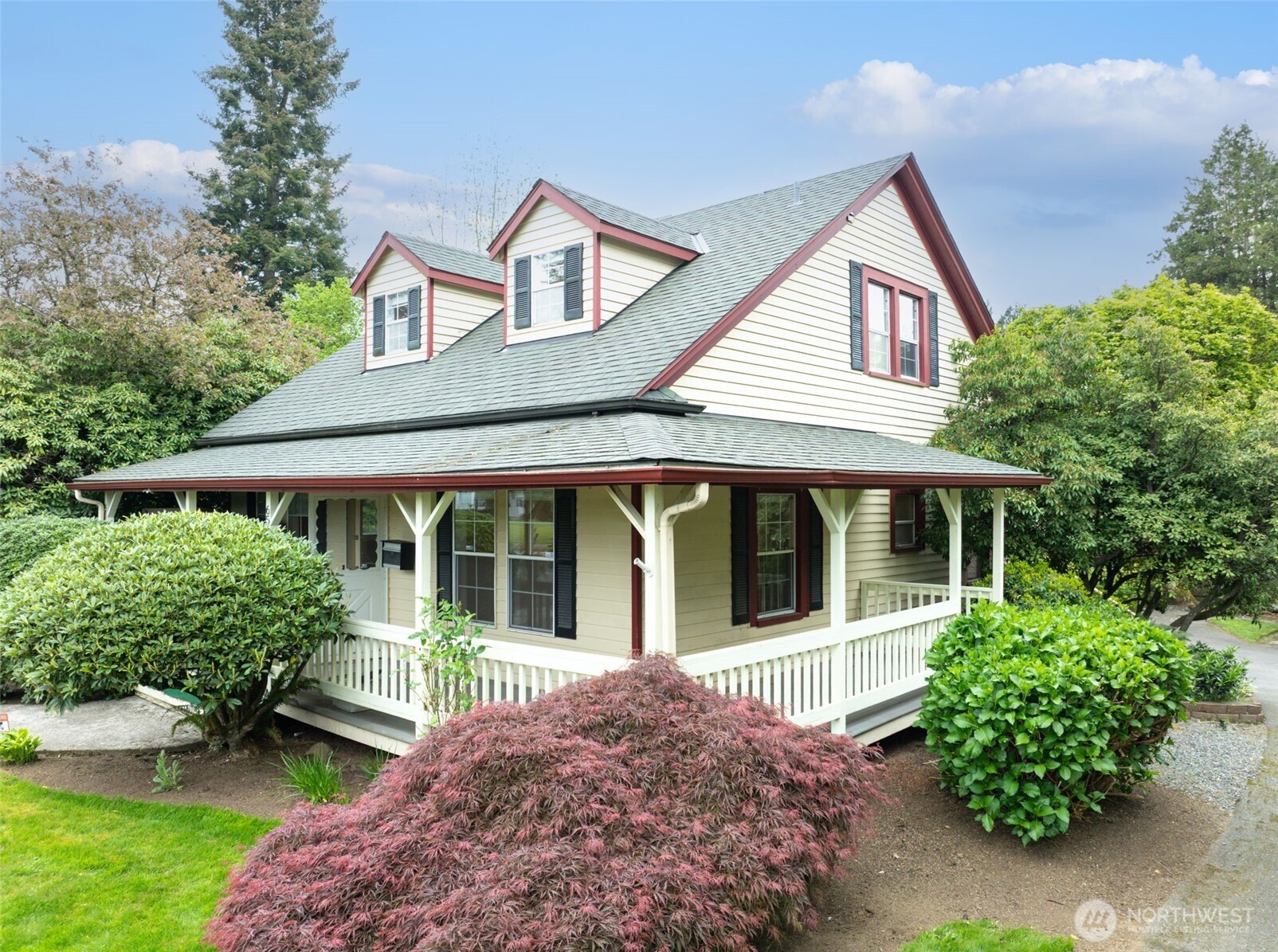 654 West Main Street Monroe, WA 98272 - Photo 1 of 40 front view of a house with a garden