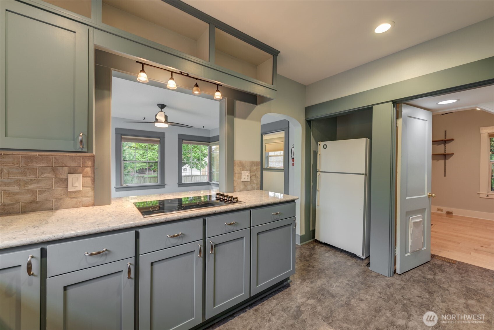 654 West Main Street Monroe, WA 98272 - Photo 13 of 40 a kitchen with a sink and refrigerator