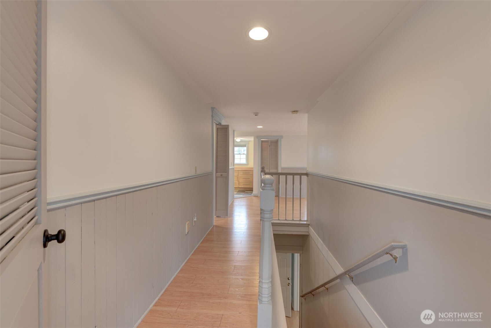 654 West Main Street Monroe, WA 98272 - Photo 20 of 40 a view of a hallway with wooden floor and staircase