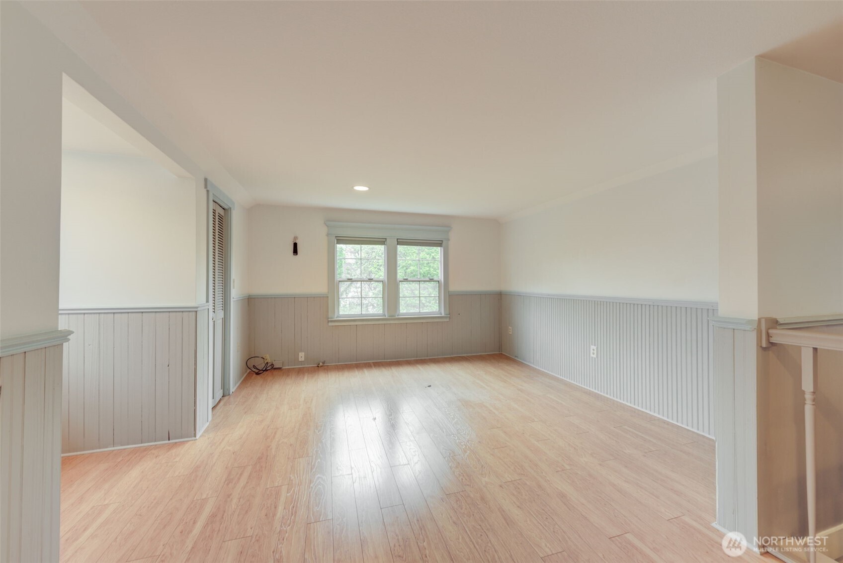 654 West Main Street Monroe, WA 98272 - Photo 21 of 40 an empty room with wooden floor and windows
