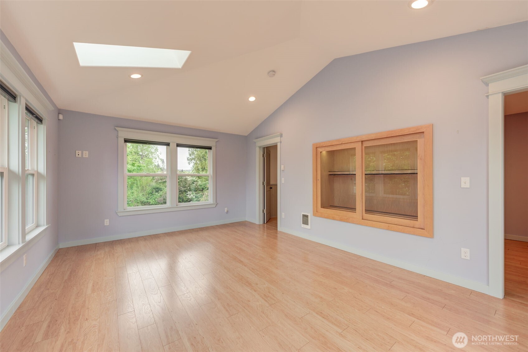 654 West Main Street Monroe, WA 98272 - Photo 26 of 40 an empty room with wooden floor and windows