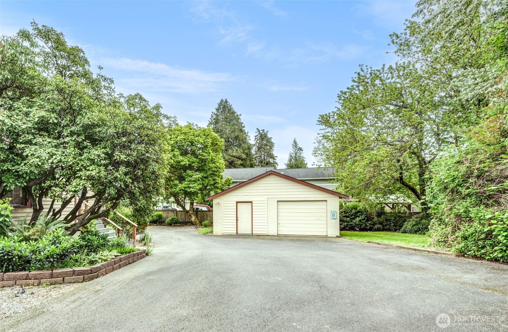 654 West Main Street Monroe, WA 98272 - Photo 33 of 40 a view of a house with a yard and garage