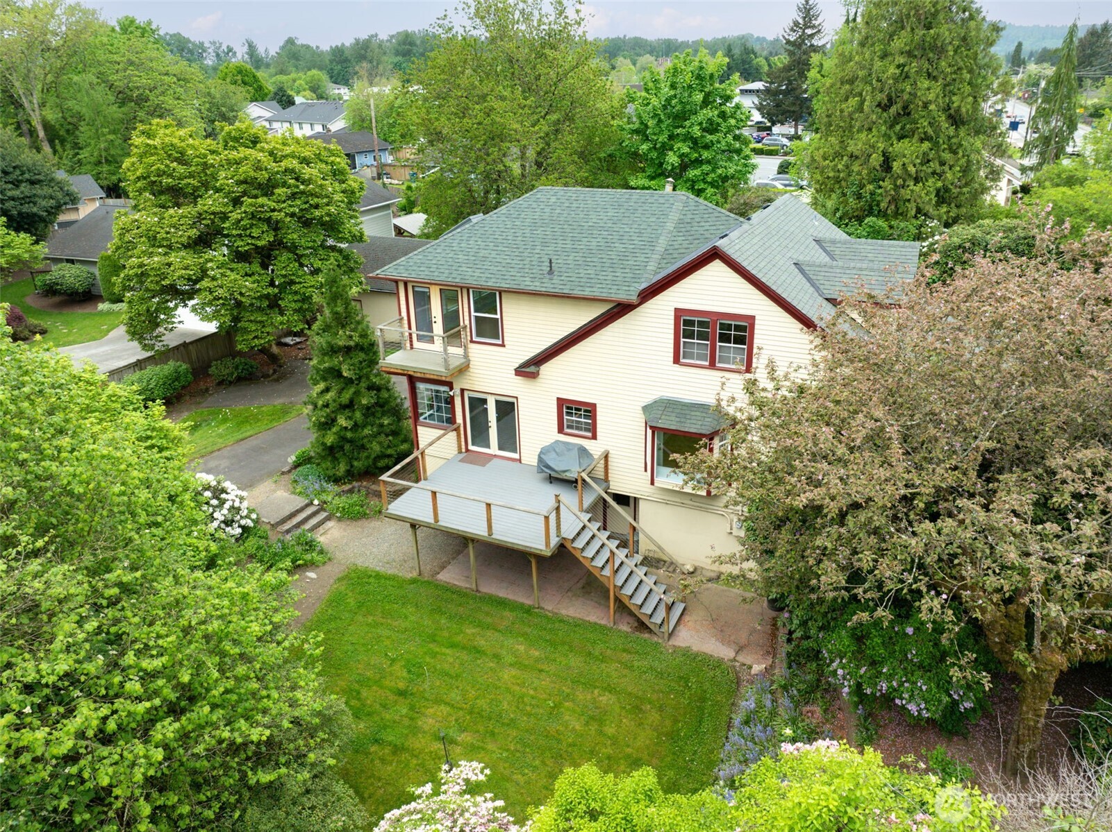 654 West Main Street Monroe, WA 98272 - Photo 4 of 40 a view of a house with a yard and sitting area
