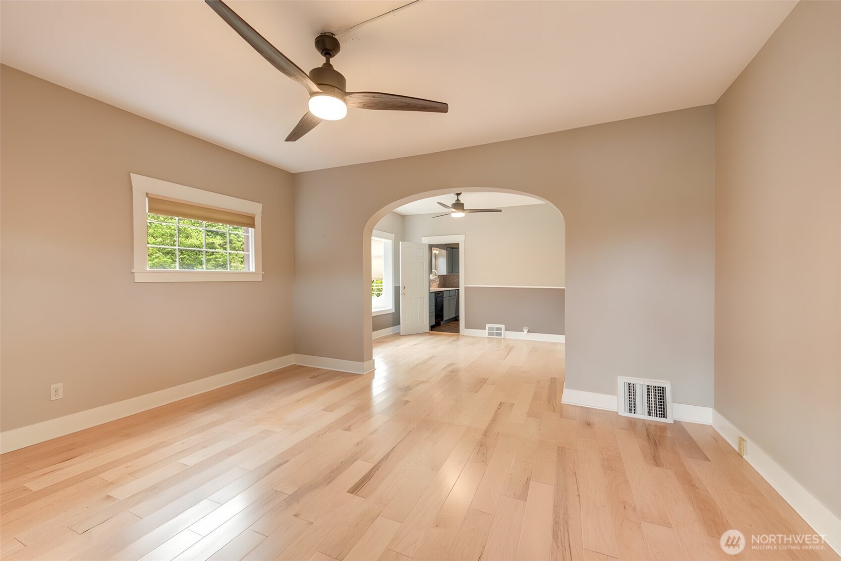 654 West Main Street Monroe, WA 98272 - Photo 7 of 40 a view of empty room with a fireplace and fan