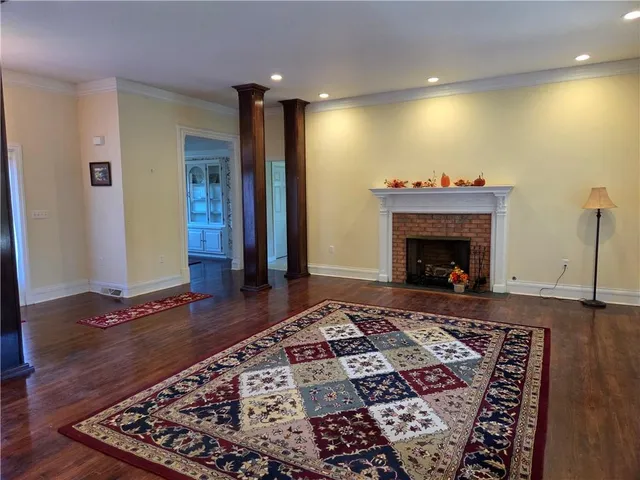 a living room with a rug