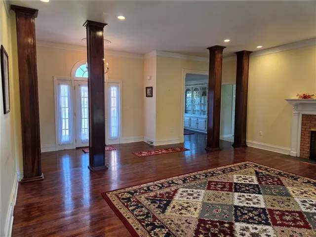 a bathroom with a bathtub and a rug