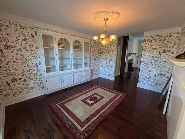 a view of a living room and wooden floor