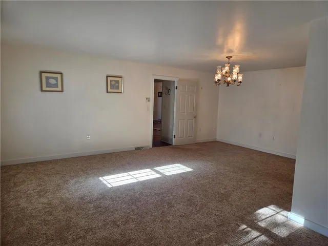 a view of empty room with windows