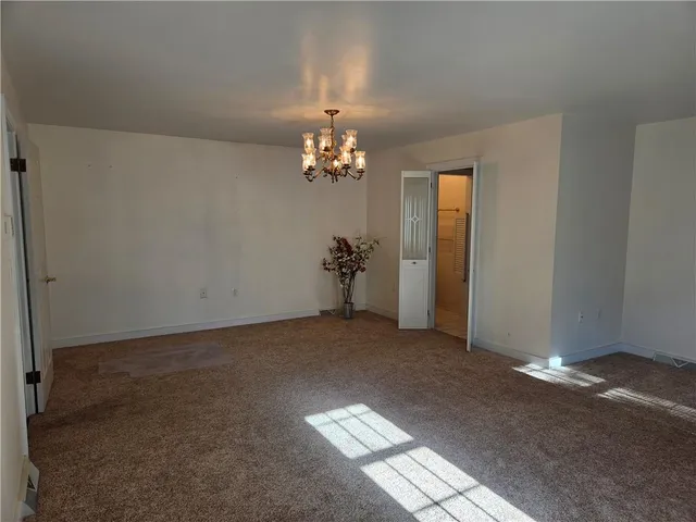 a view of a chandelier in an empty room