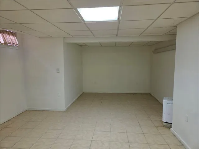 a view of a livingroom with a couch and a stove top oven