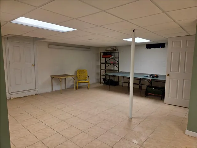 a white toilet sitting next to a shower curtain