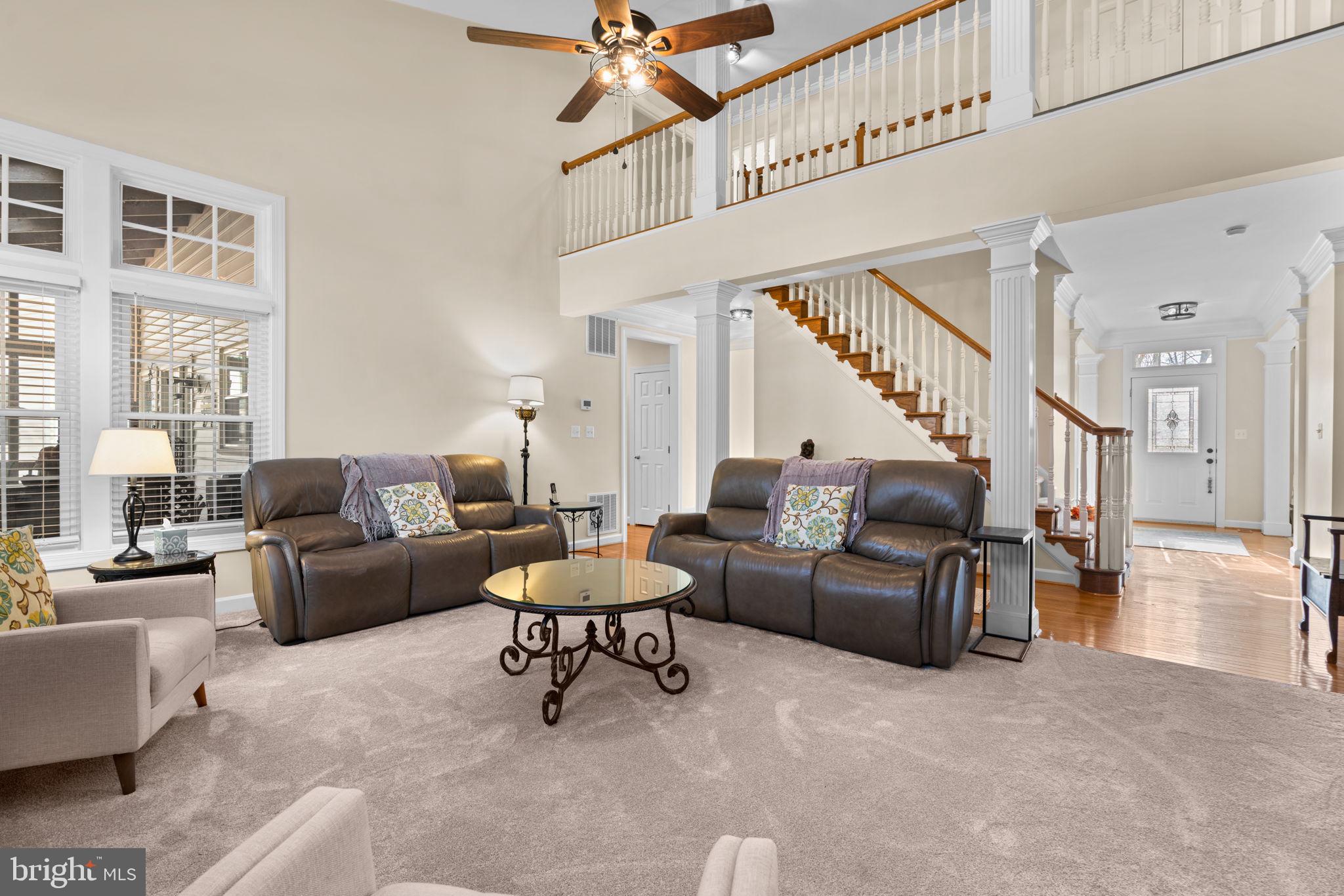 4617 Brightwood Road Olney, MD 20832 - Photo 13 of 58 a living room with furniture and a large window