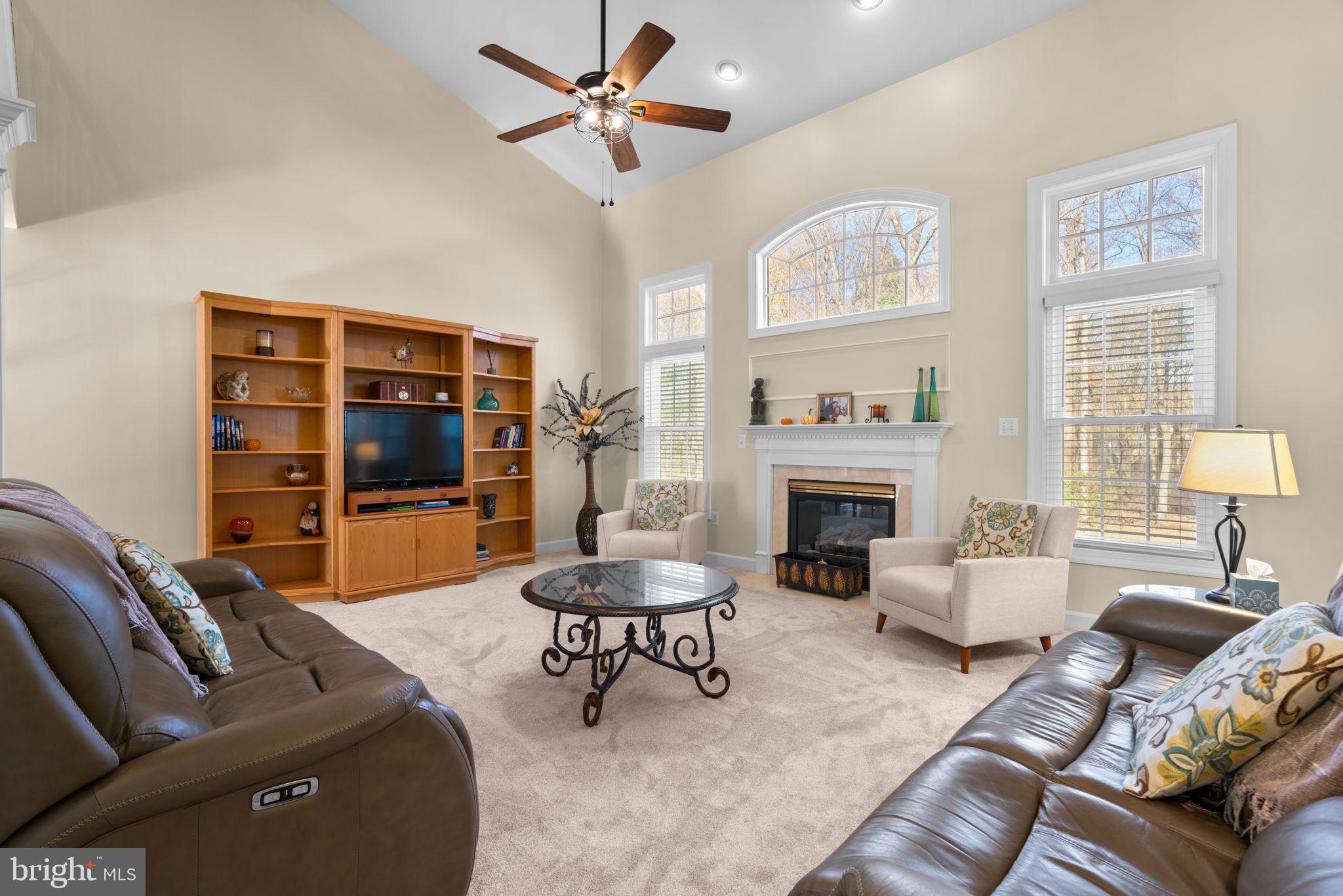 4617 Brightwood Road Olney, MD 20832 - Photo 14 of 58 a living room with furniture and a fireplace