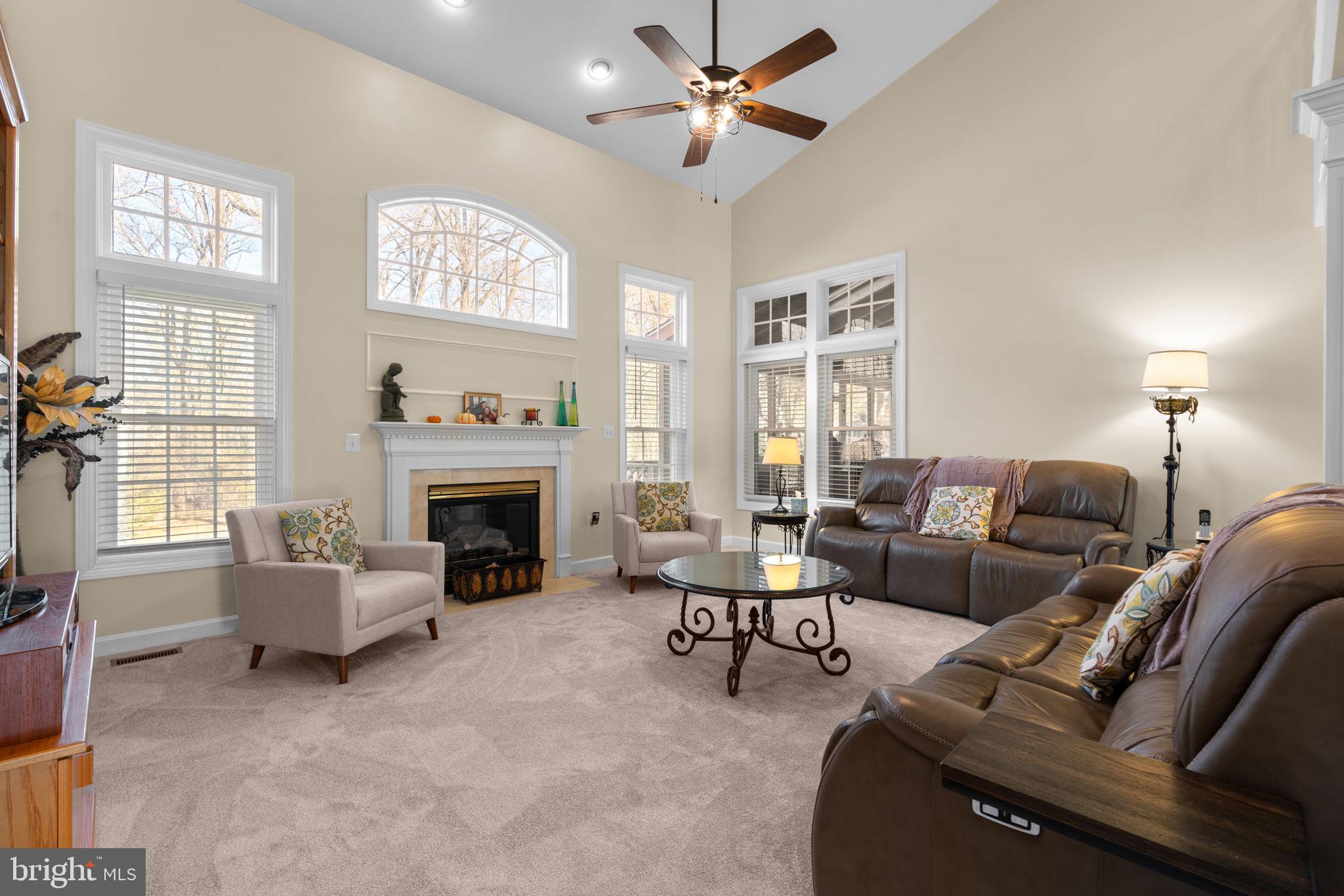 4617 Brightwood Road Olney, MD 20832 - Photo 15 of 58 a living room with furniture and a fireplace