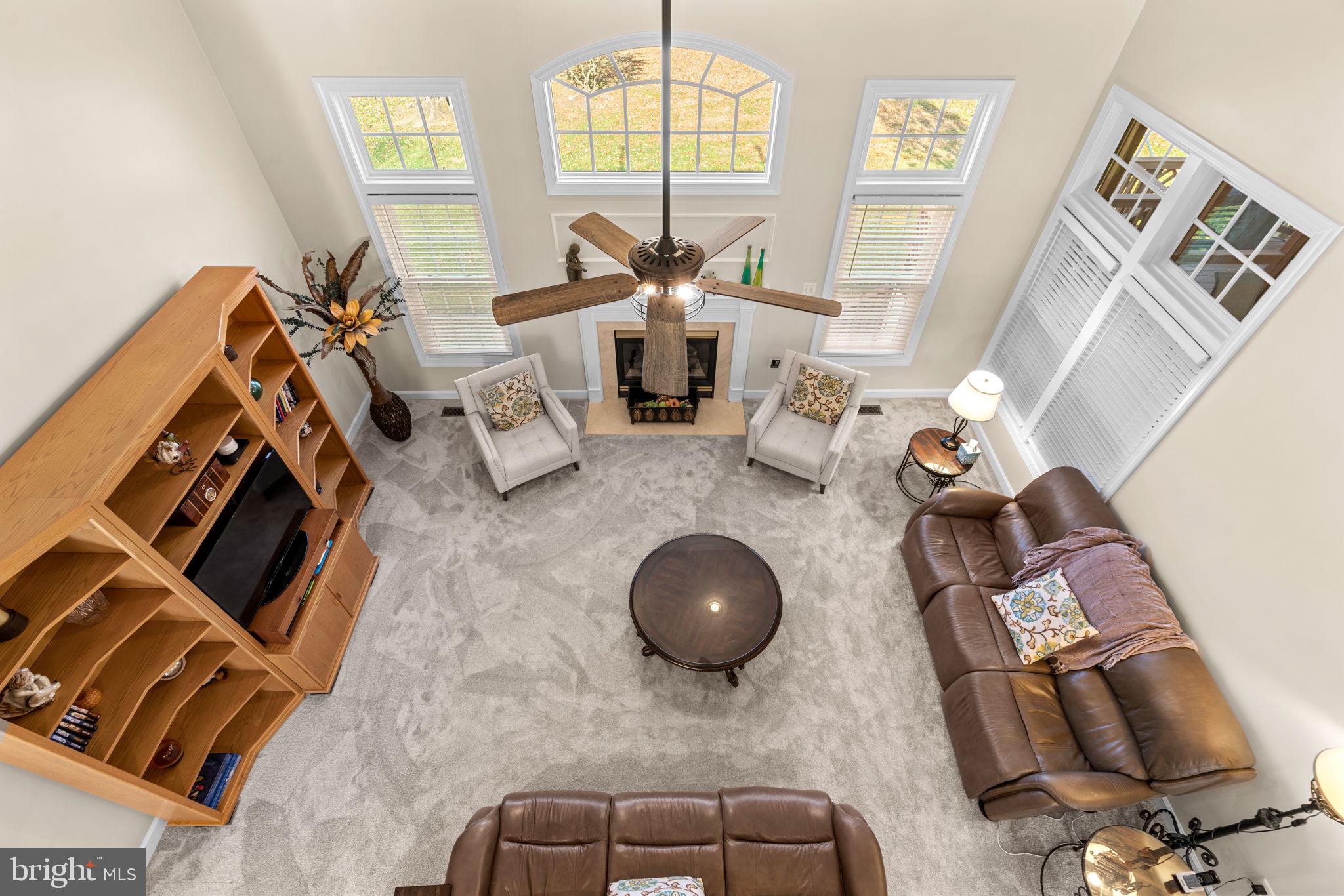 4617 Brightwood Road Olney, MD 20832 - Photo 16 of 58 a living room with furniture and a fireplace