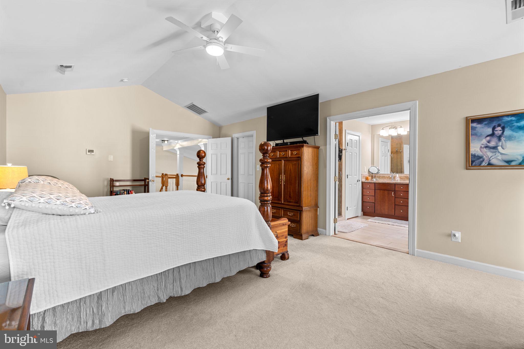 4617 Brightwood Road Olney, MD 20832 - Photo 27 of 58 a bed room with a bed and a flat screen tv