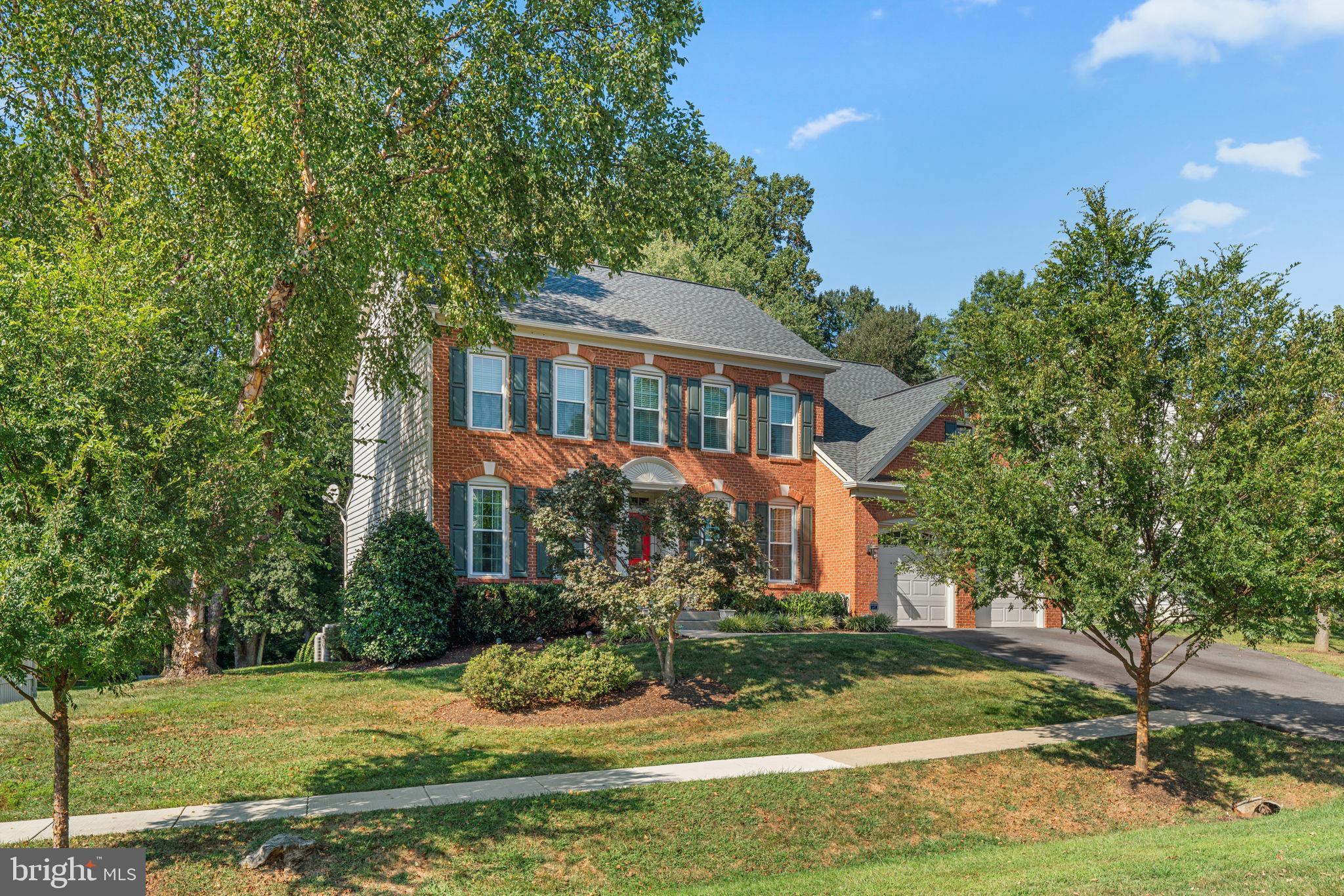 4617 Brightwood Road Olney, MD 20832 - Photo 3 of 58 a front view of a house with a yard