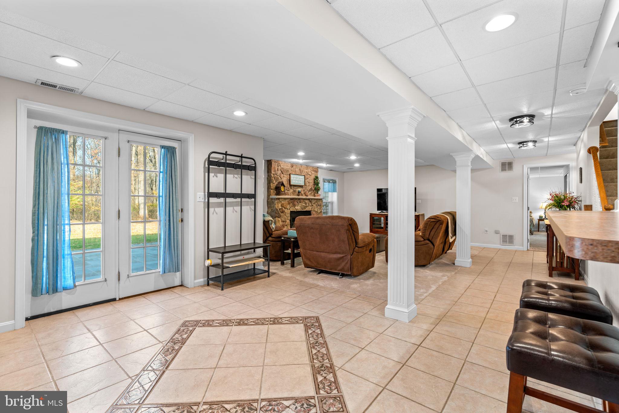 4617 Brightwood Road Olney, MD 20832 - Photo 45 of 58 a large room with lots of furniture and a rug